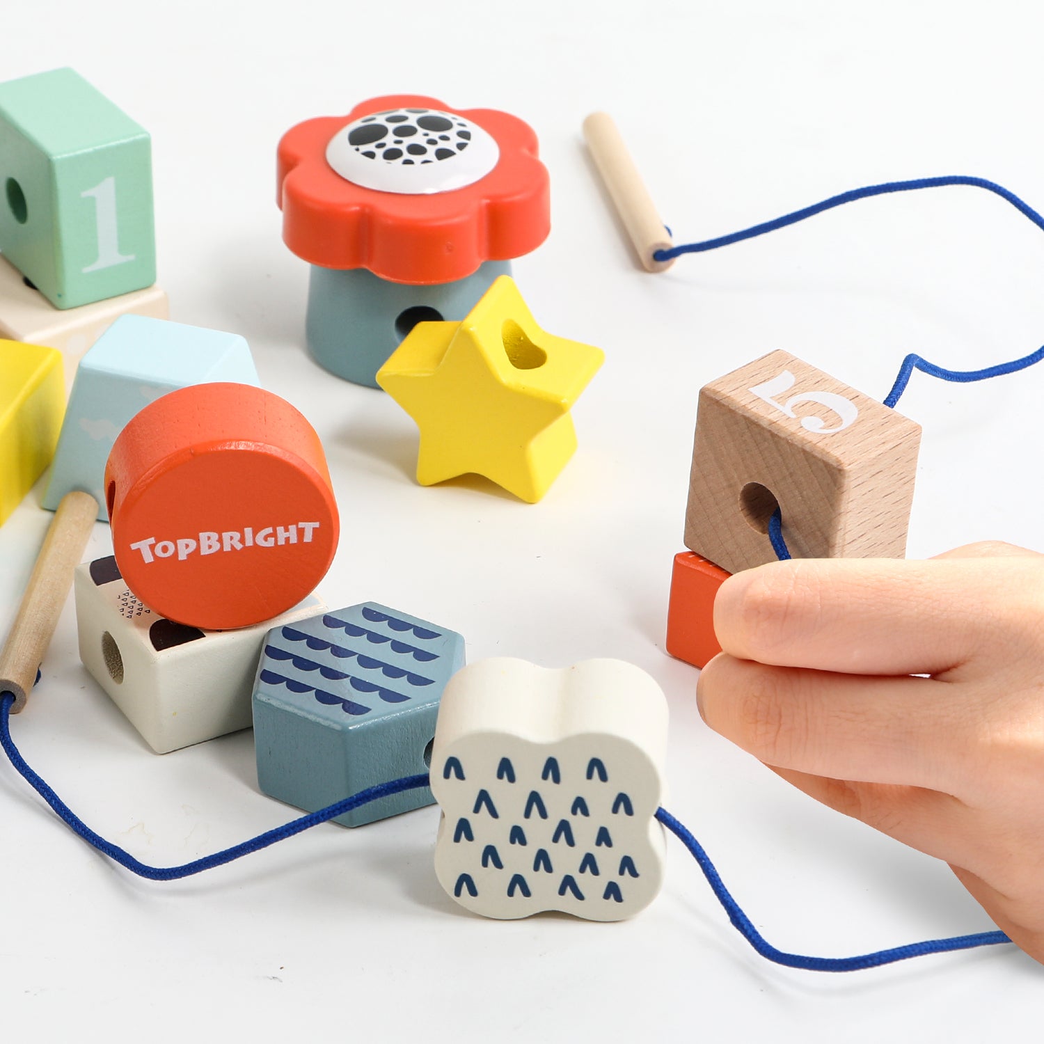 Versatile classic toy: With the fun Lacing Shapes Caterpillar, children aged 18 months and over thread colourful building blocks onto a cute caterpillar.  The colourful educational game convinces with colourful building blocks in many different shapes made of wood and all kinds of game variations.